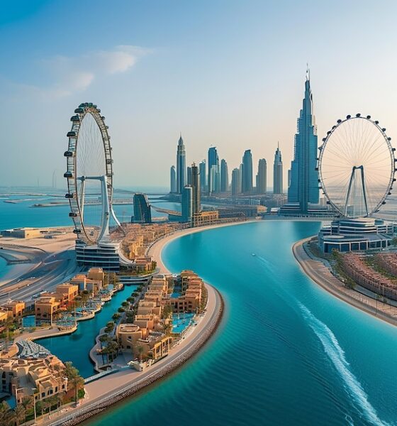 Interior view of Dubai Mall with shoppers exploring luxury retail stores and the famous Dubai Aquarium in the background"