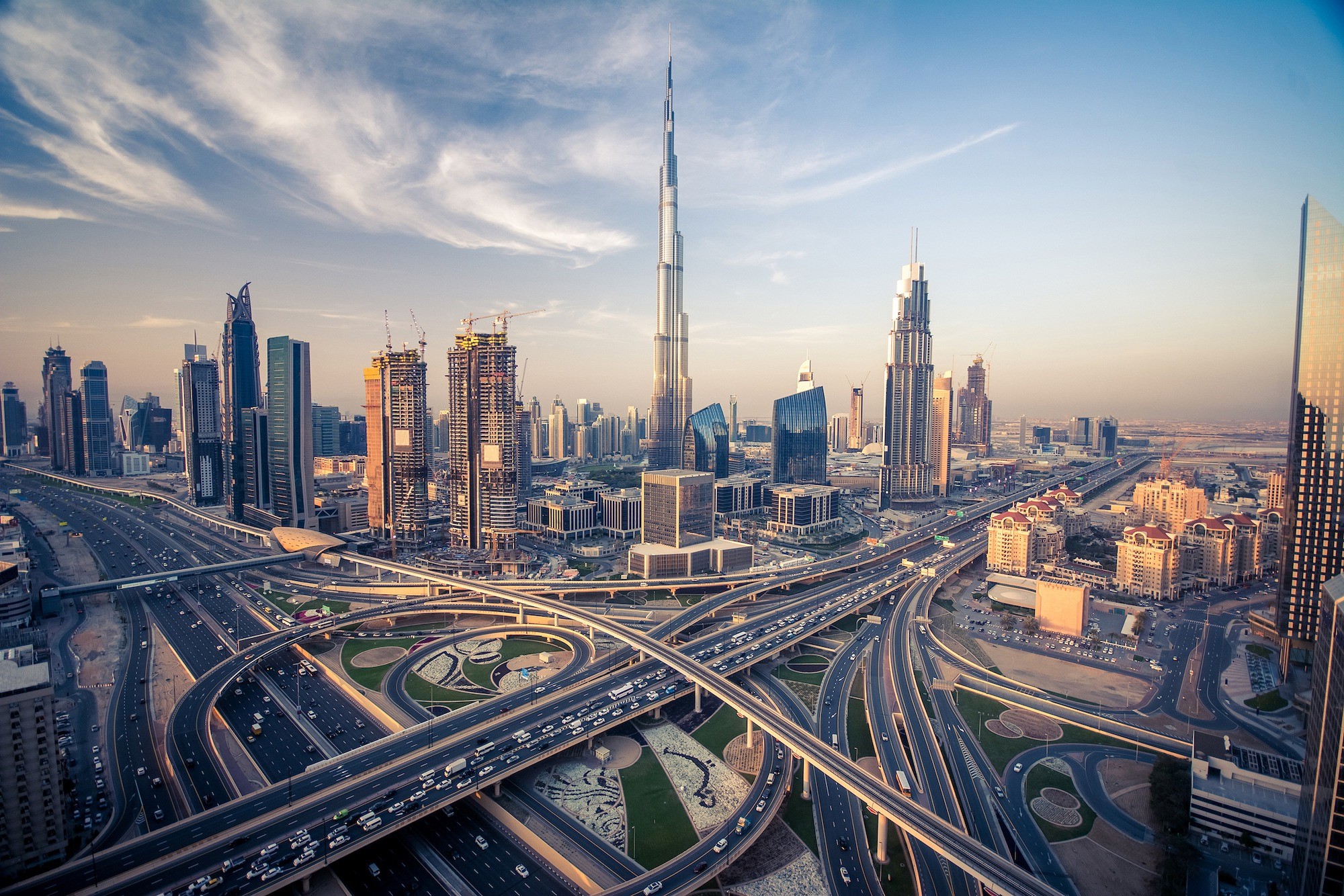 UAE construction law legal consultation with Dubai skyline showing modern buildings and cranes representing construction disputes